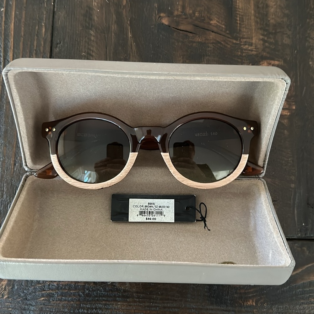 BCBG Max Azria brown and wood tone sunglasses with case.